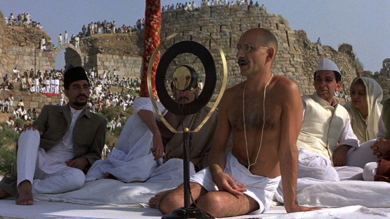 In 1893, Gandhi is thrown off a South African train for being an Indian and traveling in a first class compartment. Gandhi realizes that the laws are biased against Indians and decides to start a non-violent protest campaign for the rights of all Indians in South Africa. After numerous arrests and the unwanted attention of the world, the government finally relents by recognizing rights for Indians, though not for the native blacks of South Africa. After this victory, Gandhi is invited back to India, where he is now considered something of a national hero. He is urged to take up the fight for India's independence from the British Empire. Gandhi agrees, and mounts a non-violent non-cooperation campaign of unprecedented scale, coordinating millions of Indians nationwide. There are some setbacks, such as violence against the protesters and Gandhi's occasional imprisonment. Nevertheless...